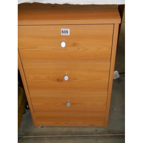 609 - A pine effect three drawer chest, COLLECT ONLY.