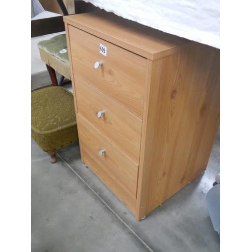 609 - A pine effect three drawer chest, COLLECT ONLY.