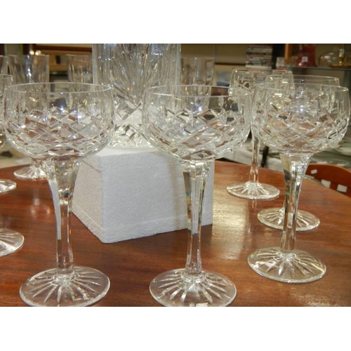 614 - A cut glass decanter and two sets of six glasses. COLLECT ONLY.