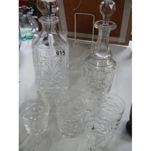 615 - Two decanters and a quantity of glasses. COLLECT ONLY.