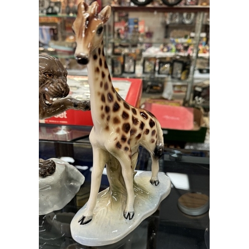 320 - A Jema Holland ceramic giraffe & A large Beswick Puma on rock