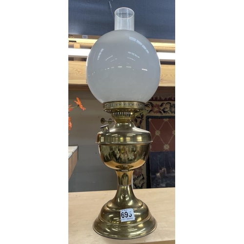 695 - An Oil lamp with shade. COLLECT ONLY