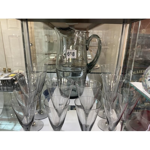 698 - A quantity of glasses in Smokey grey colour and jug. 3 sizes of glasses COLLECT ONLY