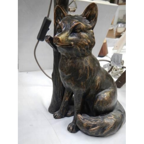 748 - A table lamp featuring a figure of a fox. COLLECT ONLY