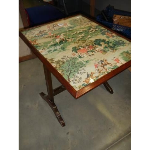 759 - A tip up table/fire screen featuring a hunting scene. COLLECT ONLY.