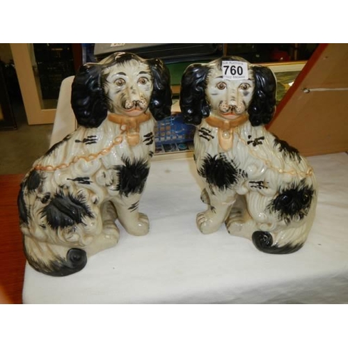 760 - A good pair of Staffordshire spaniels.