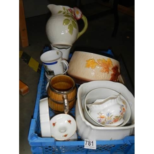 781 - A mixed lot including Aynsley cottage garden vase, Wade and Sylvac planters etc.,