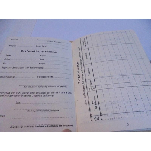 1135 - An old German rubber stamps and a German registration book.