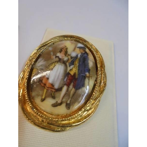 1142 - A pair of brooches in the style of Angelica kaufmann,