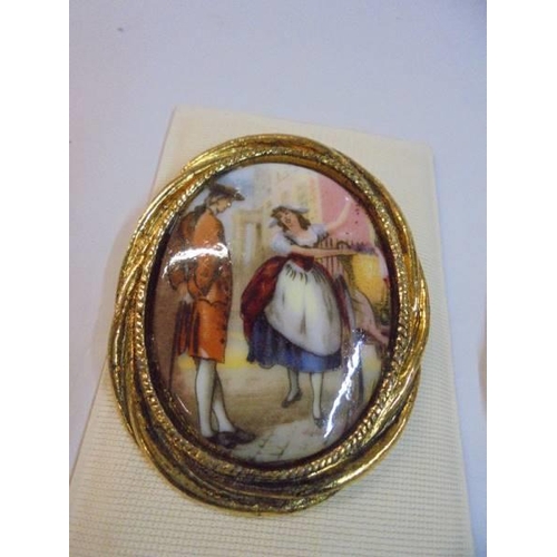 1142 - A pair of brooches in the style of Angelica kaufmann,