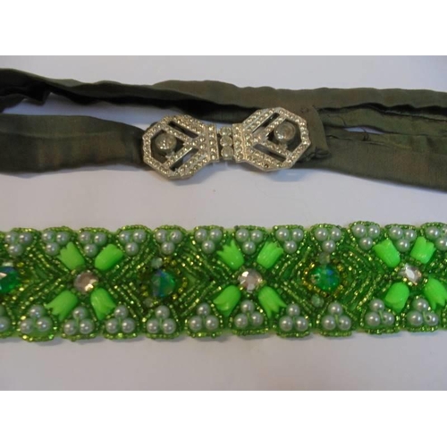 1144 - A green stone choker, a black stone choker and one other.