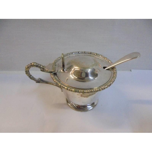 1153 - A pair of silver plate salts with spoons and blue glass liners and three others.