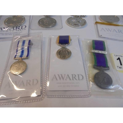 1158 - Four replica long service medals and three miniatures.