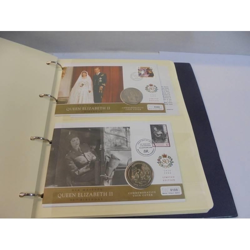 1163 - An album of Queen Elizabeth II 80th birthday coin covers and three other coin covers.