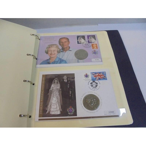 1163 - An album of Queen Elizabeth II 80th birthday coin covers and three other coin covers.