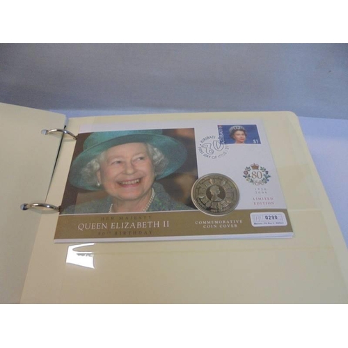 1163 - An album of Queen Elizabeth II 80th birthday coin covers and three other coin covers.