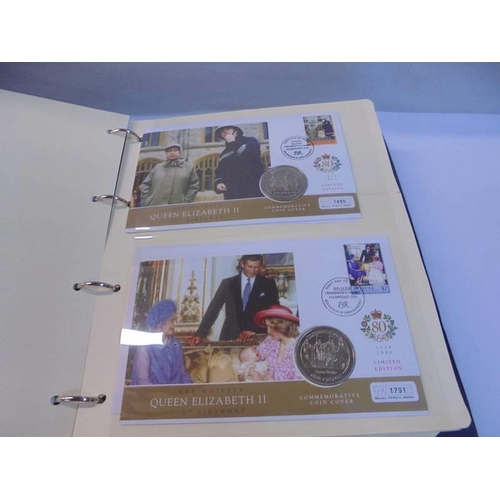 1163 - An album of Queen Elizabeth II 80th birthday coin covers and three other coin covers.