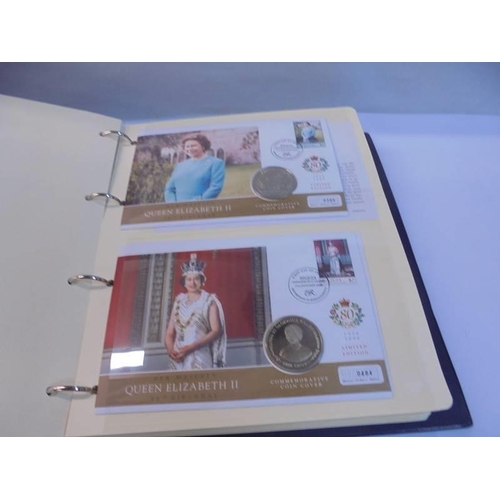 1163 - An album of Queen Elizabeth II 80th birthday coin covers and three other coin covers.