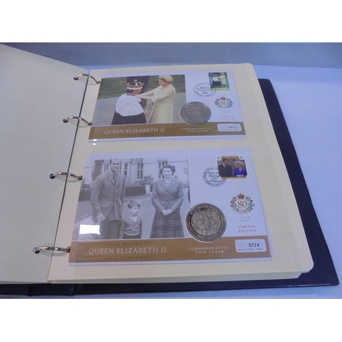 1163 - An album of Queen Elizabeth II 80th birthday coin covers and three other coin covers.