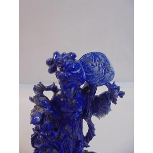 1169 - A Chinese carved blue stone figure,