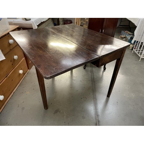 823 - A mahogany fold over card table, COLLECT ONLY.