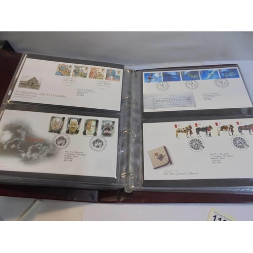 1180 - A Royal Mail first day covers album with 60 first day covers.