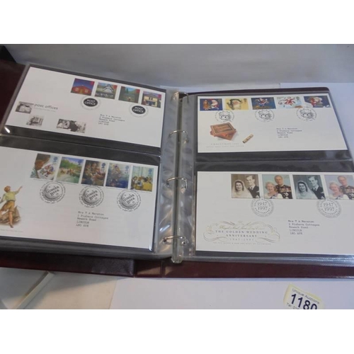 1180 - A Royal Mail first day covers album with 60 first day covers.