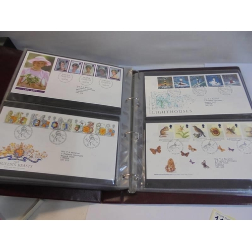 1180 - A Royal Mail first day covers album with 60 first day covers.