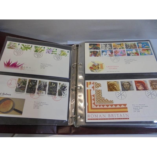 1180 - A Royal Mail first day covers album with 60 first day covers.