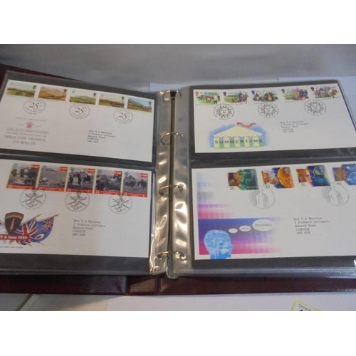 1180 - A Royal Mail first day covers album with 60 first day covers.