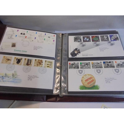 1180 - A Royal Mail first day covers album with 60 first day covers.