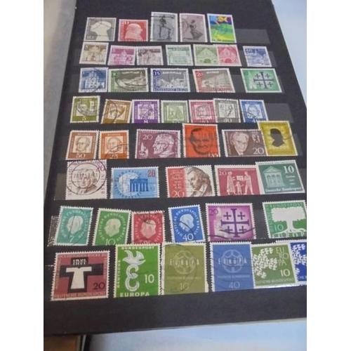 1182 - A collection of five albums of stamps including GB and commonwealth.