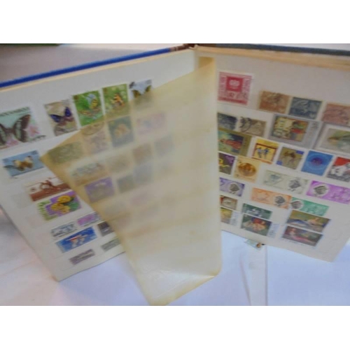 1182 - A collection of five albums of stamps including GB and commonwealth.