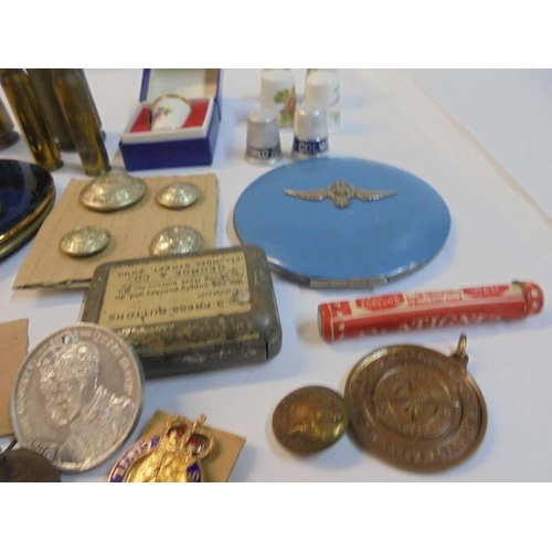 1188 - A mixed lot including powder compacts, badges, buttons etc.,