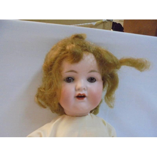 1196 - A 19th century German porcerlain doll marked 990 A-2-M.