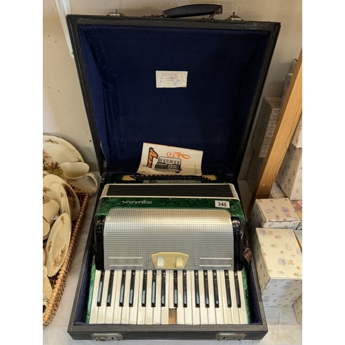 340 - A vintage Russian accordion (in green) A/F (1 key broken)  COLLECT ONLY