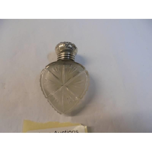 1200A - Two small silver topped scent bottles (one with original stopper).