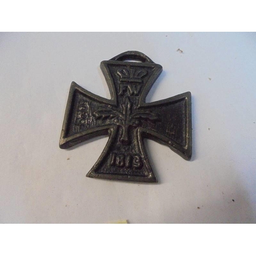 1200B - A WW1 anti German propaganda iron cross and an 1813 Imperial cross.