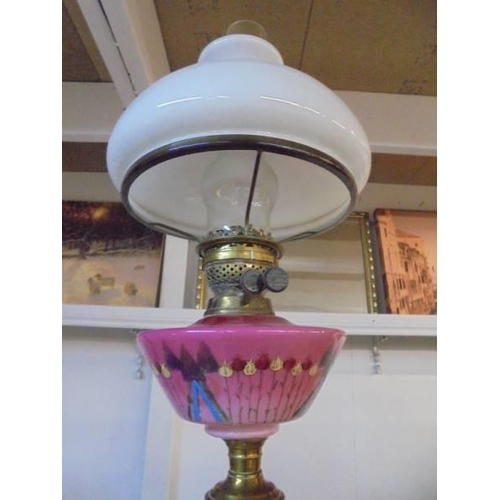 1219 - A Victorian oil lamp with painted pink glass font, COLLECT ONLY.