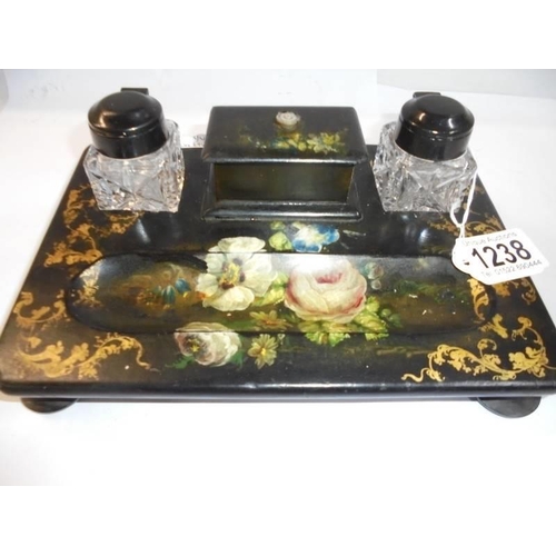 1238 - A papier mache' inkstand with painted floral decoration.