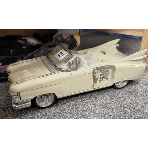 227 - A novelty clock in the shape of a 1950s Cadillac & A boxed remote control hovercraft