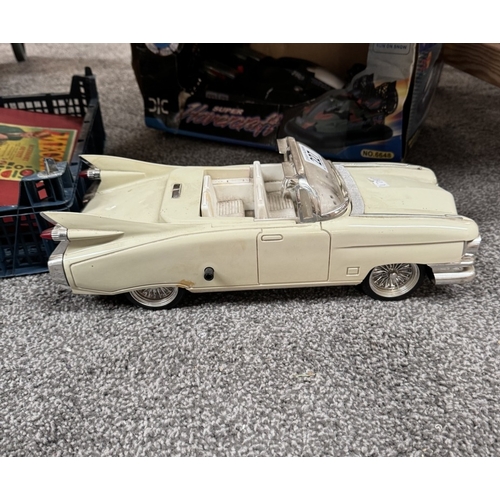 227 - A novelty clock in the shape of a 1950s Cadillac & A boxed remote control hovercraft