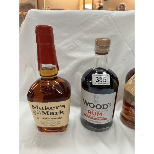 385 - A bottle of Mahers Mark Kentucky whiskey, a bottle of Wood's Old navy rum & a bottle of Buffalo Trac... 