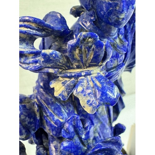 1169 - A Chinese carved blue stone figure,