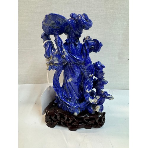 1169 - A Chinese carved blue stone figure,