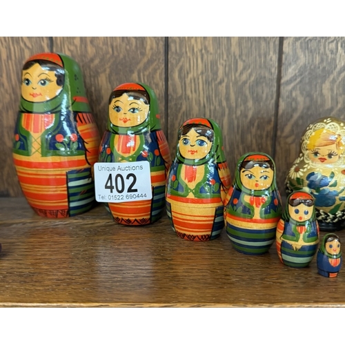 402 - 5 Russian nesting dolls all with 5 pieces