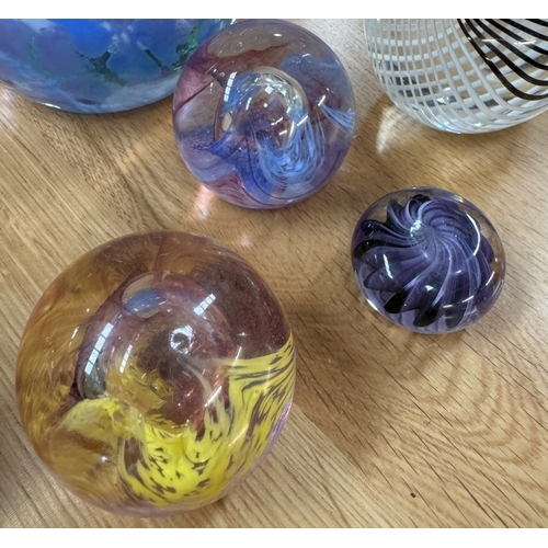 413 - A quantity of glass paperweights including Caithness & an art glass swan