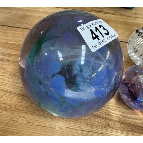 413 - A quantity of glass paperweights including Caithness & an art glass swan