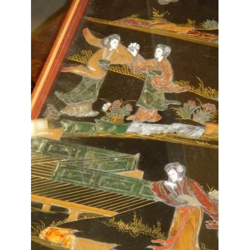 1517 - An excellent black lacquered panel with Chinese soapstone figures made into a table with a glazed to... 