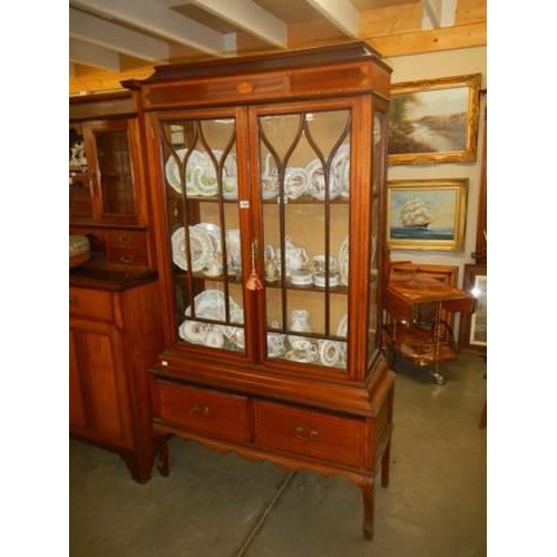 1554 - An Edwardian inlaid two drawer two door cabinet. COLLECT ONLY.